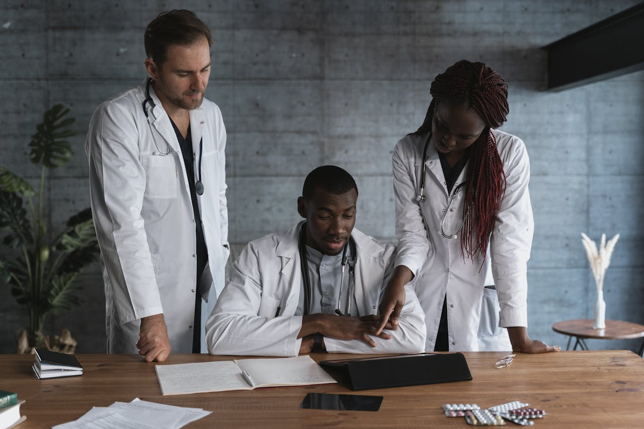 Three scientists collaborating on a project in a lab.