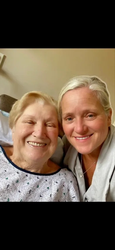 Two smiling women posing for selfie