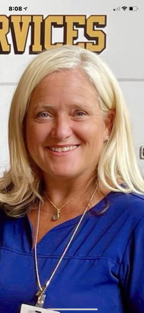 Smiling blonde woman in blue blouse portrait