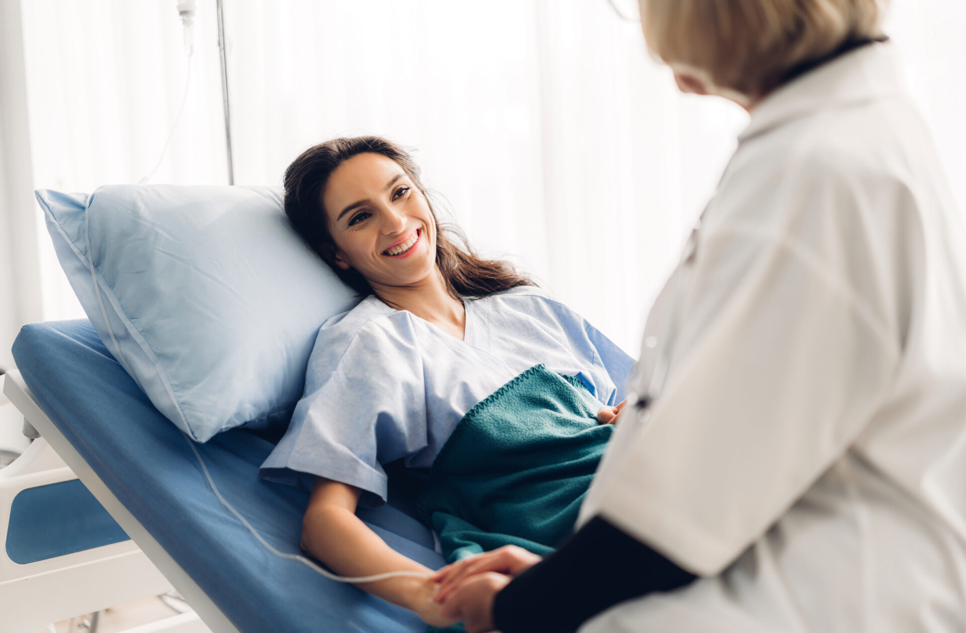 Patient smiling while interacting with doctor.